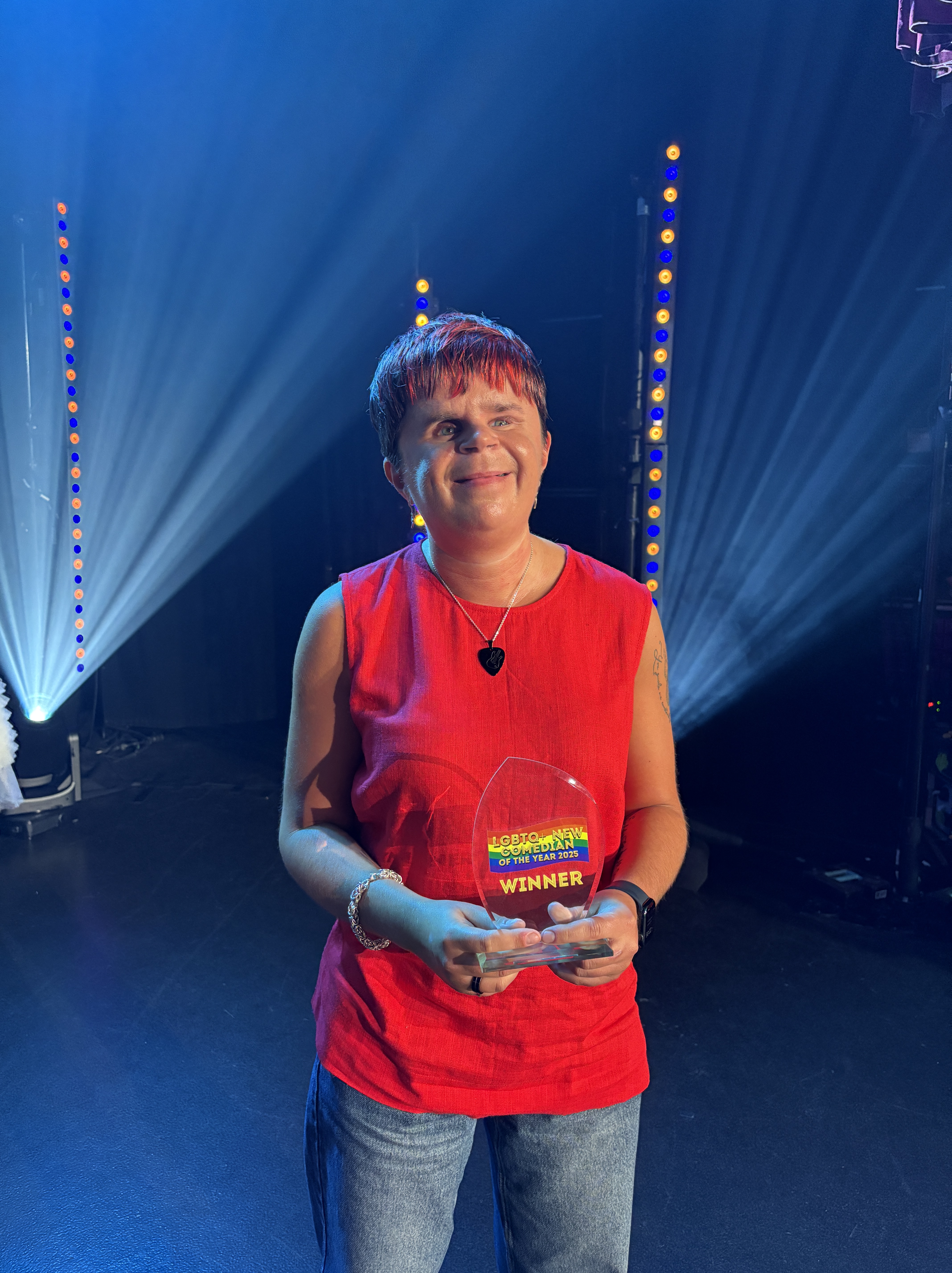 Sydney holding Comedy Bloomers award 2025